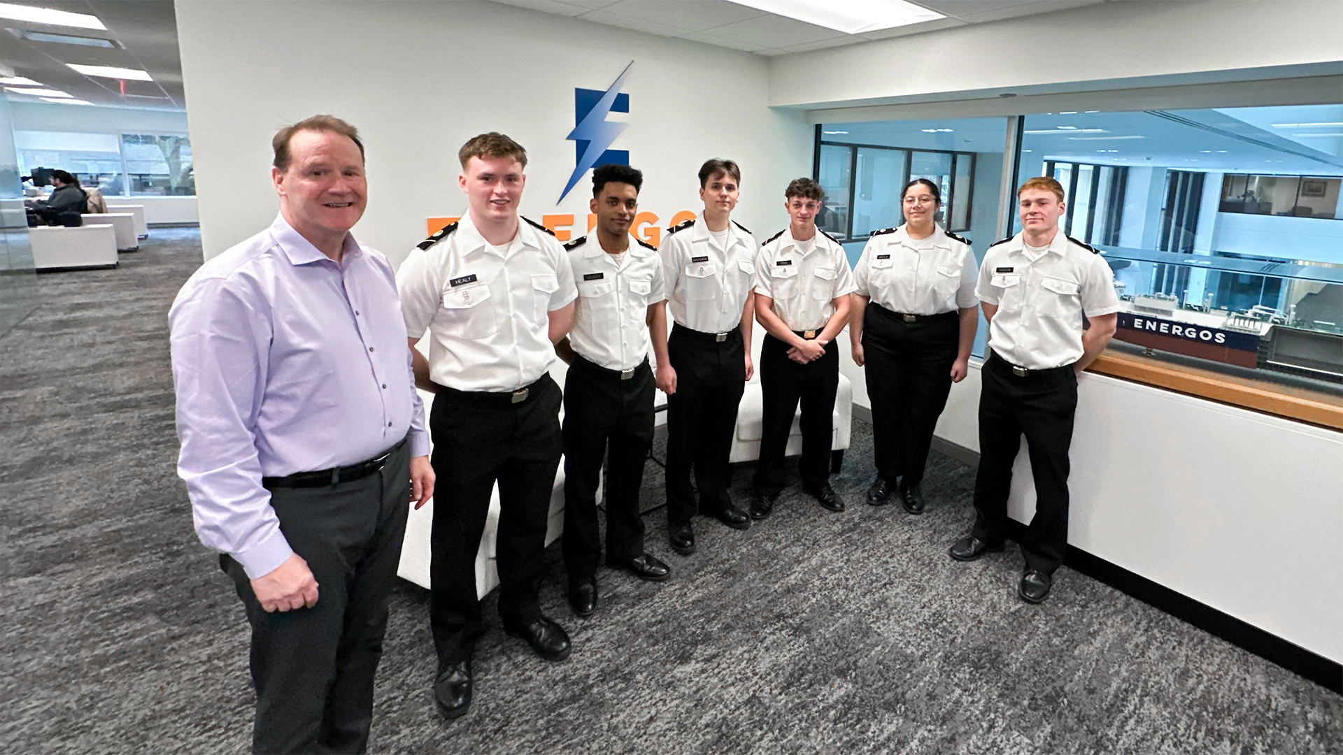 SUNY Maritime College cadets pictured with Energos Infrastructure CEO, Arthur Regan